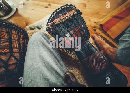 Man playing the drum top view. Stock Photo