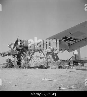 A vintage photo circa May 1943 showing a wrecked German Messerschmitt Me 323 Gigant transport aircraft at El Aouiana Tunisia after the defeat of the Axis forces in North Africa in World War Two Stock Photo