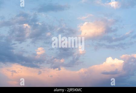 Sky with pink, orange and purple clouds just after sunset Stock Photo