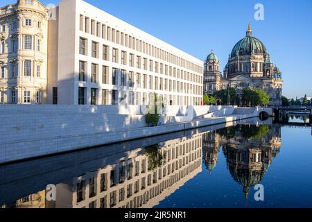 The rebuilt Berlin City Palace with the Cathedral reflected in the river Spree Stock Photo