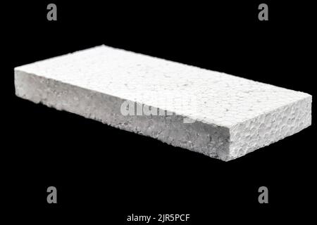 styrofoam board isolated on black background, non-toxic polystyrene material, thermoplastic and flexible resin, used in the transport, construction an Stock Photo