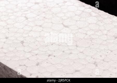 styrofoam board isolated on black background, non-toxic polystyrene material, thermoplastic and flexible resin, used in the transport, construction an Stock Photo