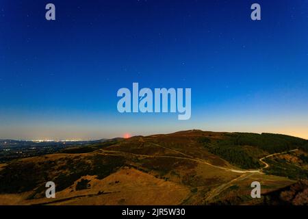 Perseid meteor over Moel Famau in the Clwydian Range, North Wales Stock Photo
