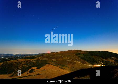 Perseid meteor over Moel Famau in the Clwydian Range, North Wales Stock Photo