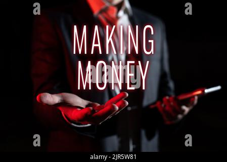 Text sign showing Making Money. Word for Giving the opportunity to make a profit Earn financial support Businessman In Suit Holding New Important Stock Photo