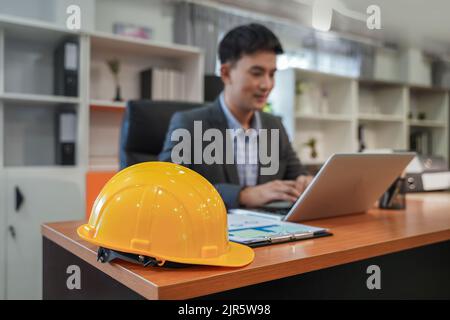 Portrait professional engineer smiles and looks in computers working with communication internet design project modern looking lifestyle background Stock Photo