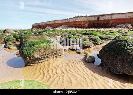 Old Hunstanton beach with red and white striped cliffs in Suffolk. Stock Photo