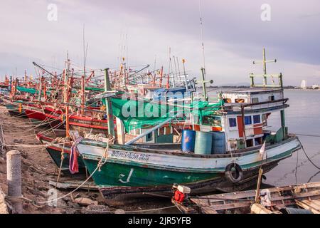 Thai fishing boats at a pier or wharf in Thailand Southeast Asia Stock Photo