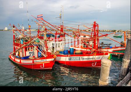 Thai fishing boats at a pier or wharf in Thailand Southeast Asia Stock Photo