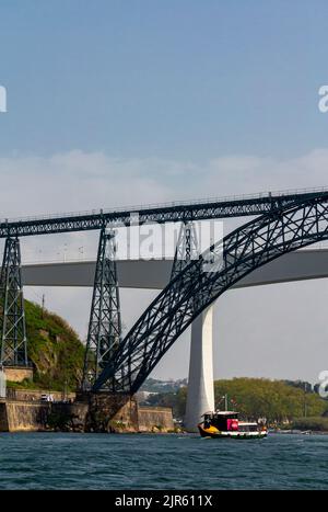 Tourist sightseeing boat sailing on the River Douro in the centre of Porto a major city in northern Portugal. Stock Photo