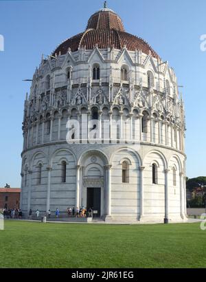The baptistery of San Giovanni is one of the monuments of the Piazza dei Miracoli, in Pisa. In front of the leaning tower of Pisa and the Cathedral. Stock Photo