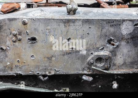 Kyiv, Ukraine. 20th Aug, 2022. Armor of a combat vehicle with traces of bullets and holes from shells and inscriptions For Borodianka and Glory to Ukraine. An exhibition of destroyed Russian equipment is being organized on Khreshchatyk. Six months ago, this military equipment were ordered by the Russian president Vladimir Putin to invade Ukraine. He reportedly reckoned that they would capture Kyiv in three days. Credit: SOPA Images Limited/Alamy Live News Stock Photo