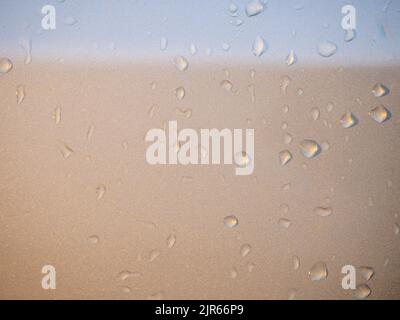 water droplets on the silver bodywork of a vehicle after rainfall Stock Photo