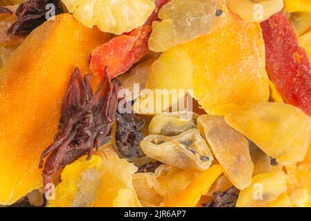 Mix of dried exotic fruit, mangos,slices of pineapples, passion fruit, papaya. Vegetarian dessert. Stock Photo