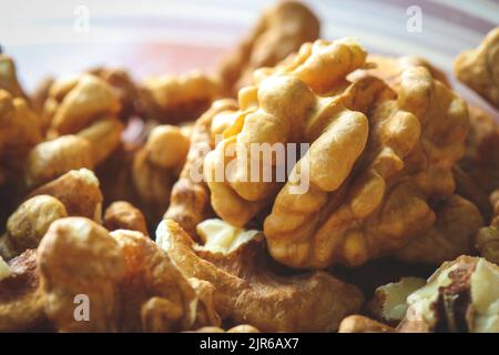 Close up on dry shelled hernel walnuts in a bowl Stock Photo