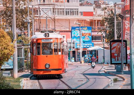 07 July 2022, Antalya, Turkey: Retro vintage tram line for tourists and locals leading to the old town centre. Stock Photo