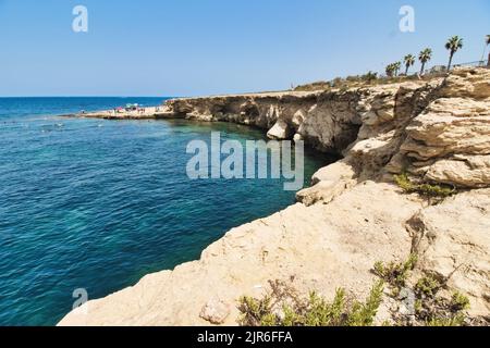 An rocky cliff inlet on the coast of Bugibba, St. Paul's Bay in Malta Stock Photo