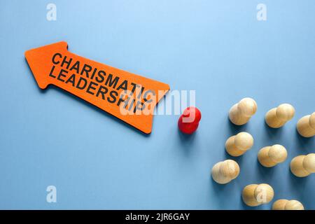 Arrow with words Charismatic leadership and figurines. Stock Photo