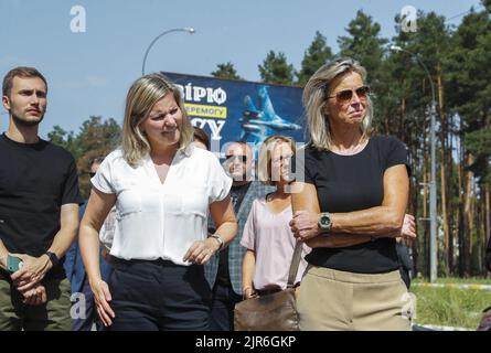 2022-08-22 11:48:44 Dutch Minister of Foreign Trade and Development Liesje Schreinemacher (L) and Minister of Defense Kajsa Ollongren (R), attend their visit to the cemetery of damaged civilian cars in the city of Irpin near Kyiv, Ukraine, 22 August 2022. Dutch Ministers of Foreign Trade and Development Liesje Schreinemacher and Minister of Defense Kajsa Ollongren visit Kyiv and suraund cities to meet with Ukrainian officials. Irpin as well as other towns and villages in the northern part of the Kyiv region became battlefields and were heavily shelled when Russian troops tried to reach the Ukr Stock Photo