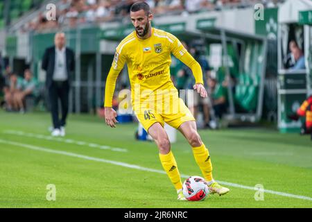 BUDAPEST, HUNGARY - JULY 13: Aleksa Amanovic of FC Tobol challenges  Kristoffer Zachariassen of Ferencvarosi TC during the UEFA Champions League  2022/23 First Qualifying Round Second Leg match between Ferencvarosi TC and