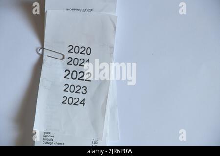 years in the checklist 2020,2021,2022,2023 as a list of years printed on checks, new year 2022 on paper as a background, a list with a list of years Stock Photo