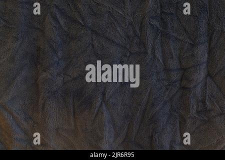 Close up background of texture of dark blue bath towel filling the frame. Stock Photo