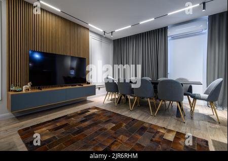 Luxury living room and kitchen in studio apartment Stock Photo