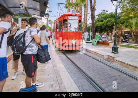 07 July 2022, Antalya, Turkey: Retro vintage tram line for tourists and locals at the old town centre Stock Photo