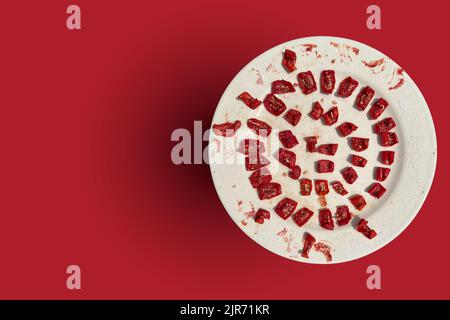 Fresh tomatoes picked from the garden were sliced and left to dry on a plate in the open air. Stock Photo