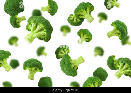 Falling broccoli, isolated on white background, clipping path, full depth of field Stock Photo