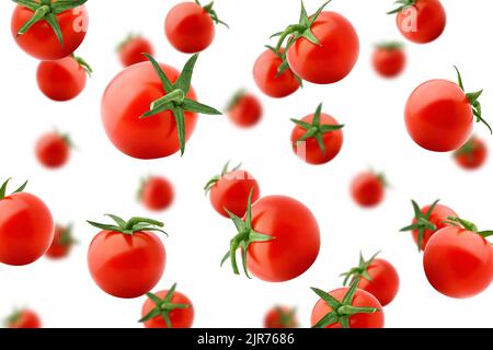 Falling tomato cherry isolated on white background, selective focus Stock Photo