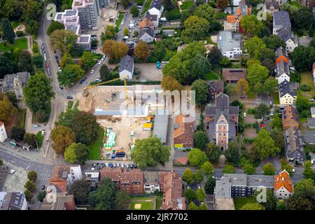 Aerial view, construction site at Dorstfelder Hellweg and St. Barbara church in Dorstfeld district in Dortmund, Ruhr area, North Rhine-Westphalia, Ger Stock Photo