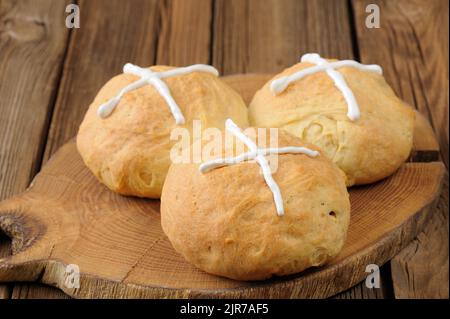 Hot cross buns on wooden board horizontal Stock Photo