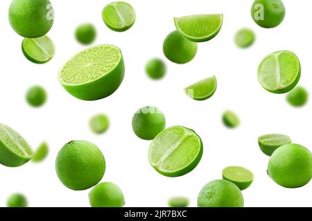 Falling lime isolated on white background, selective focus Stock Photo