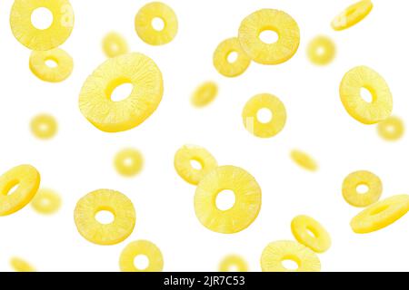Falling pineapple slice, ring, isolated on white background, selective focus Stock Photo