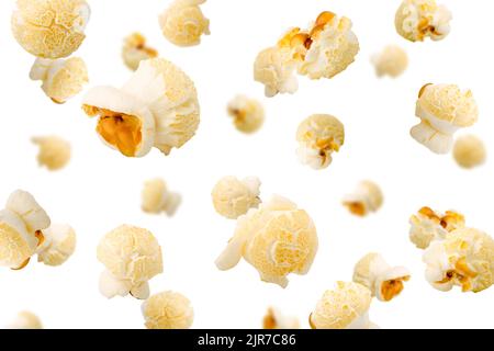 Falling popcorn, isolated on white background, selective focus Stock Photo