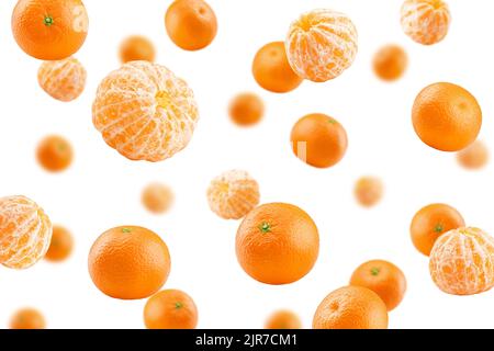 Falling mandarin, tangerine, isolated on white background, selective focus Stock Photo