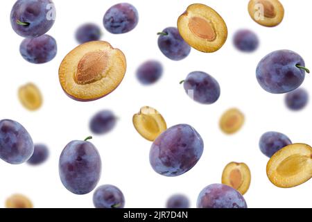 Falling plum isolated on white background, selective focus Stock Photo