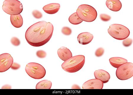 Falling red grape, isolated on white background, selective focus Stock Photo