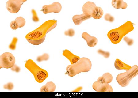 Falling pumpkin butternut squash isolated on white background, selective focus Stock Photo