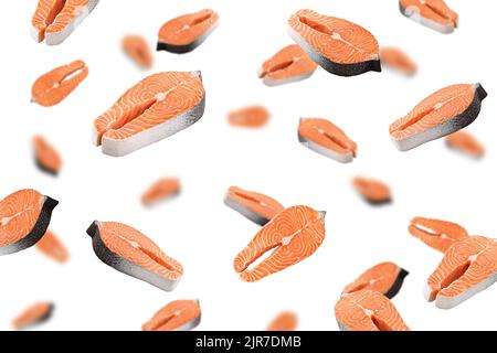 Falling salmon, trout, steak, slice of fresh raw fish, isolated on white background, selective focus Stock Photo