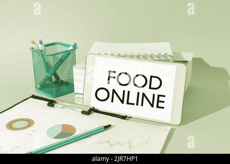 Text caption presenting Food Online, Business concept asking for something to eat using phone app or website Important Idea Shown On Phone On Desk Wit Stock Photo
