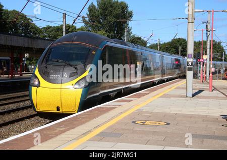 Avanti West Coast class 390 pendolino electric train arriving at Lancaster railway station on the West Coast Main Line on 17th August 2022. Stock Photo
