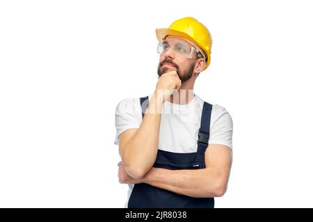 thinking male worker or builder with crossed arms Stock Photo