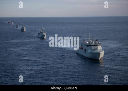 Royal Canadian Navy HMCS Margaret Brooke leads the naval convoy for a photo exercise (PHOTOEX) in the Northern Atlantic Ocean, Aug. 6, 2022. Bear was one of many multi-national vessels that were also in this formation. (U.S. Coast Guard photo by Petty Officer 3rd Class Matthew Abban) Stock Photo