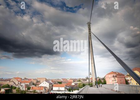 Picture of a Suspended Bridge in the city of Sremska Mitrovica, in northern Serbia, crossing the river Sava, with the city center of the city in  Srem Stock Photo