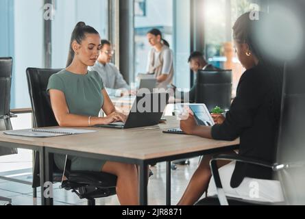 Office corporate business female employees, coworkers and team working online with digital electronics. Diverse advertising and social media marketing Stock Photo