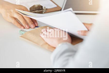 .Corruption, bribe or bribery of business people paying money or cash for an illegal scam in the office. Closeup of corrupt, criminal and abuse of Stock Photo