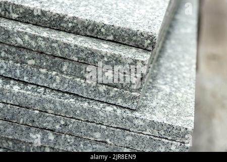 Close-up on polished granite tiles stacked on top of each other Stock Photo
