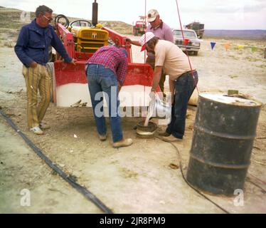 A760772 ROCK SPRINGS, WY SHALE OIL PROJECT J. GREENWOLL (Project Engineer) MAY 20 76 EG&G/NTS PHOTO LAB Publication Date: 5/20/1976  DIRT; DIRT (SOIL); EDGERTON, GERMESHAUSEN & GRIER; EG&G; EQUIPMENT; EQUIPMENT & INSTRUMENTS; EQUIPMENT (SNL); FRONT END LOADER; INSTRUMENTS & EQUIPMENT; INSTRUMENTS AND EQUIPMENT; MALE; MEN; MEN (ADD MALE MODIFIER); NEVADA TEST SITE; NTS; OIL EXPLORATION; PIPES; ROCK SPRINGS, WY; SHALE OIL PROJECT; SHALE PROJECT; TEST SITES; TRACTORS; TRACTORS (CONSTRUCTION); TRAILER INSTRUMENTATION RACKS; WIRE & CABLES; WYOMING  historical images. 1972 - 2012. Department of Ener Stock Photo